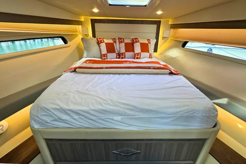 Slide: The Image of Interior of 2021 Regal 38 Grande Coupe, featuring a compact cabin space. - 36