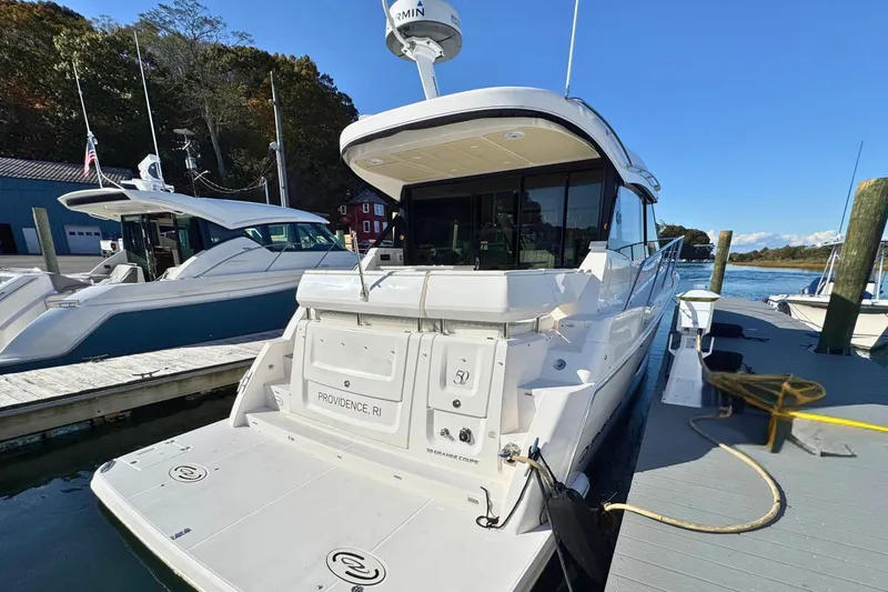 Slide: The Image of 2021 Regal 38 Grande Coupe yacht docked in Providence, RI marina. - 4