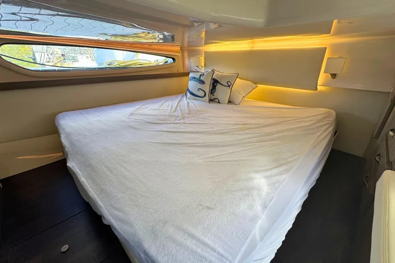 Slide: The Image of Interior of 2021 Regal 38 Grande Coupe with bed and wall-mounted TV. - 40