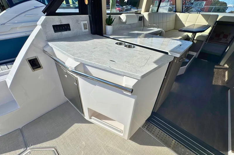 Slide: The Image of Outdoor kitchen on 2021 Regal 38 Grande Coupe yacht with grill and sink. - 9