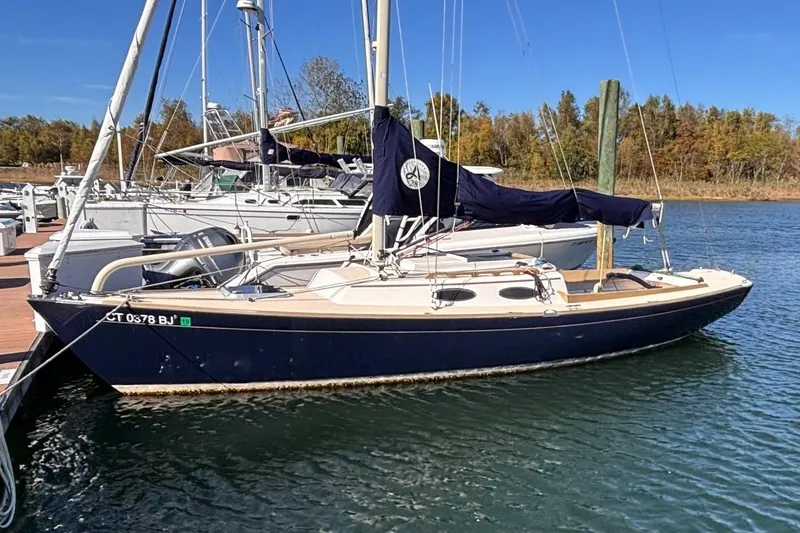 The Image of 2016 Alerion Express 28 sailboat docked at marina, clear blue sky. - 0
