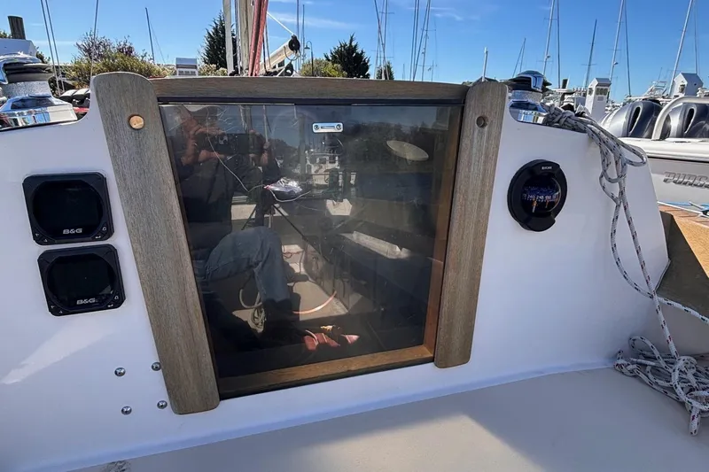 Slide: The Image of Cockpit of 2016 Alerion Express 28 sailboat with navigation instruments and ropes. - 19