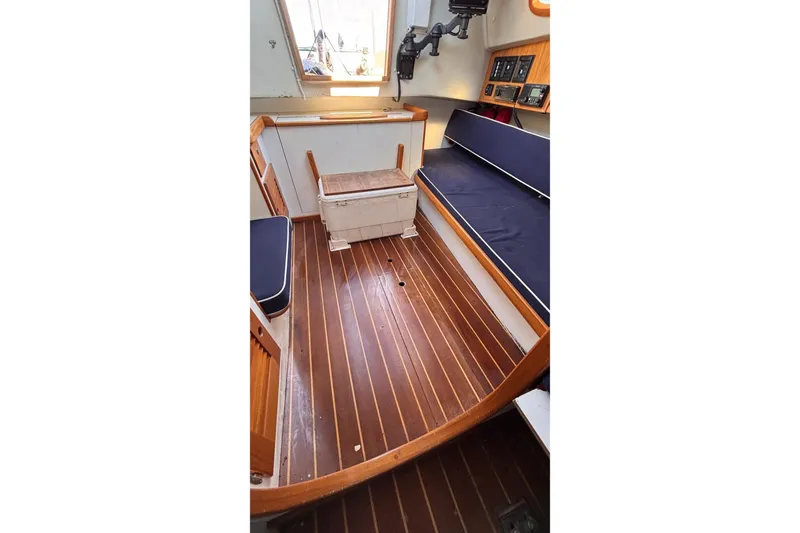 Slide: The Image of Interior of 2016 Alerion Express 28 sailboat with wooden flooring and seating. - 26