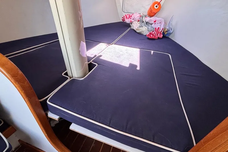 Slide: The Image of Interior cabin of 2016 Alerion Express 28 sailboat with blue cushions. - 37