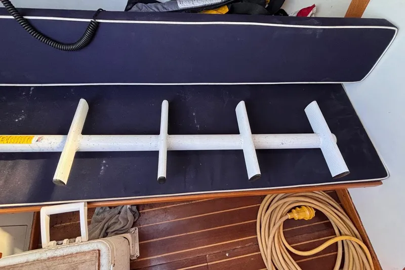 Slide: The Image of Alerion Express 28 sailboat interior with a white grab rail and coiled rope. - 38