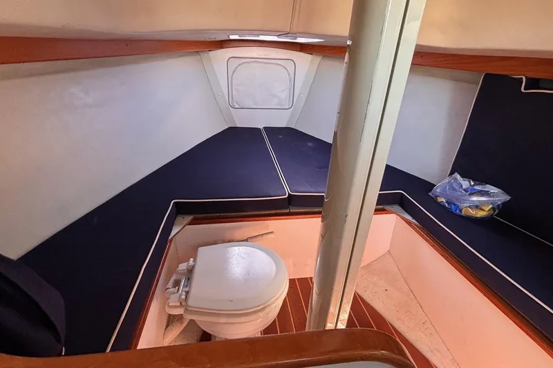 Slide: The Image of Interior cabin of 2016 Alerion Express 28 sailboat with seating and marine toilet. - 39