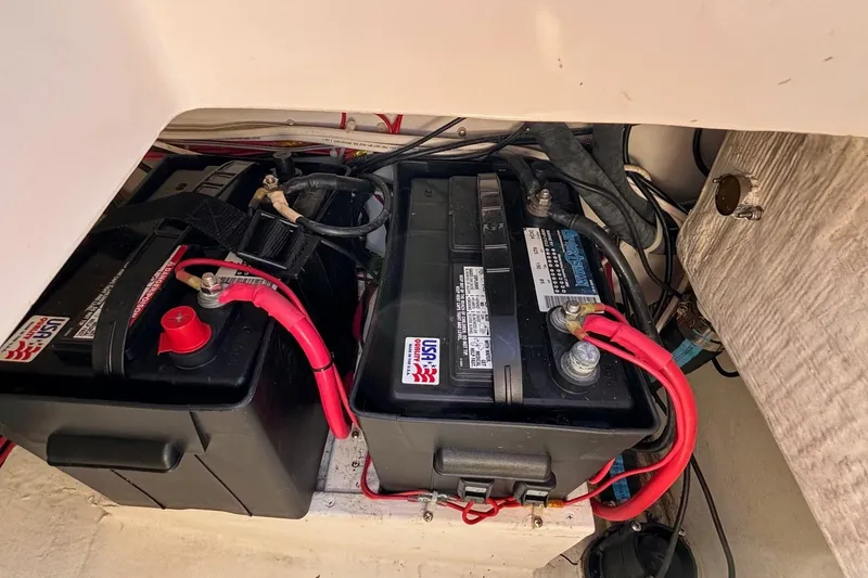 Slide: The Image of Battery compartment of a 2016 Alerion Express 28 sailboat with red cables. - 41