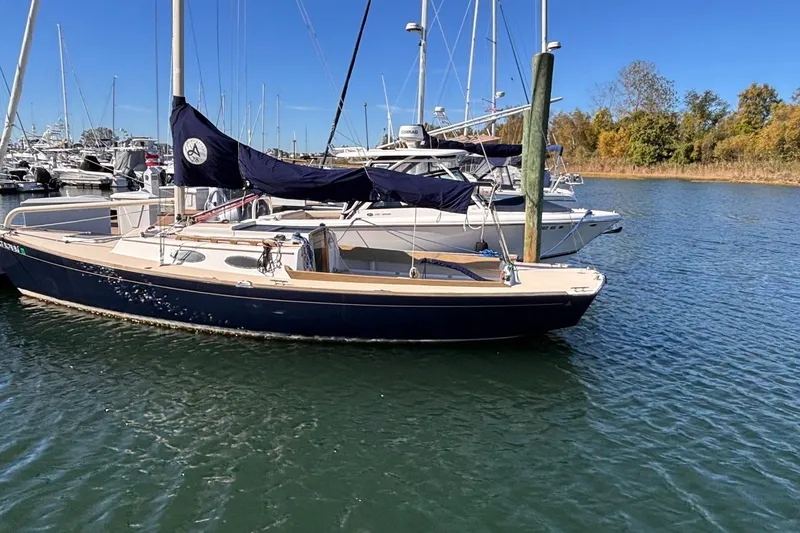 Slide: The Image of 2016 Alerion Express 28 sailboat docked in a marina on a sunny day. - 6
