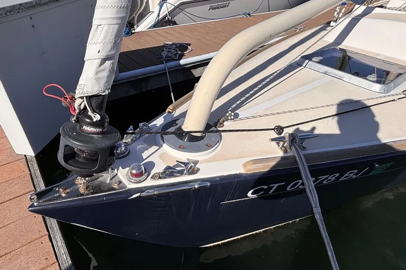 Slide: The Image of Alerion Express 28 sailboat, 2016 model, docked with visible rigging and deck details. - 9