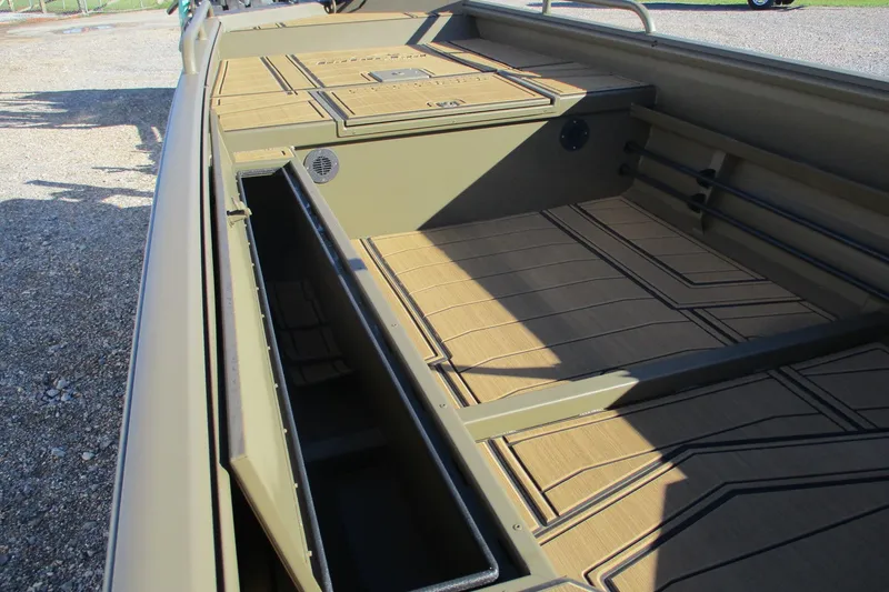 Slide: The Image of 2026 Gator Tail 1750 Savage Mid Deck boat interior with storage compartments. - 12