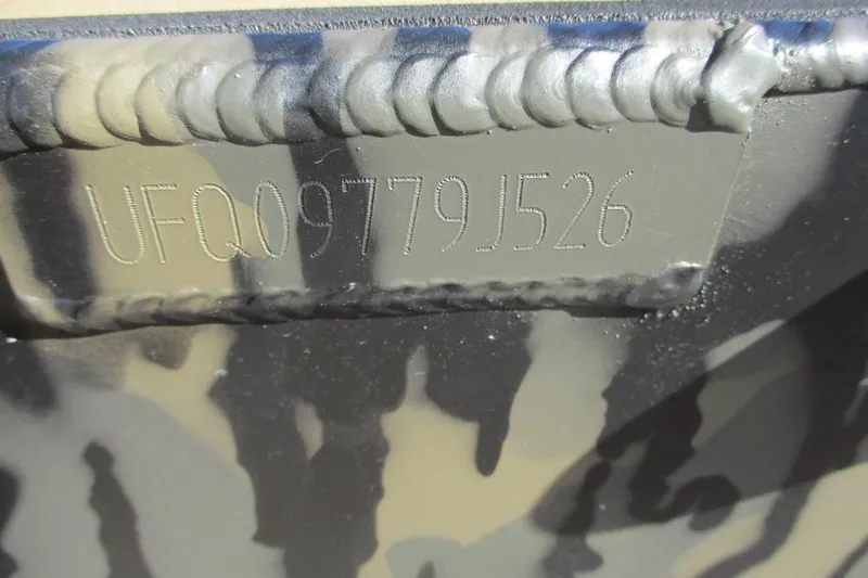 Slide: The Image of 2026 Gator Tail 1750 Savage Mid Deck hull identification number close-up. - 14