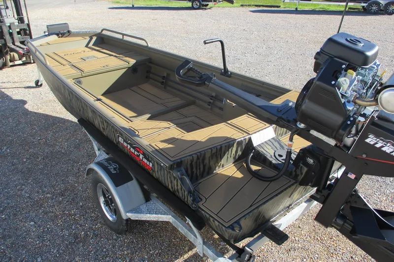 Slide: The Image of 2026 Gator Tail 1750 Savage Mid Deck boat on trailer, featuring a powerful motor. - 3