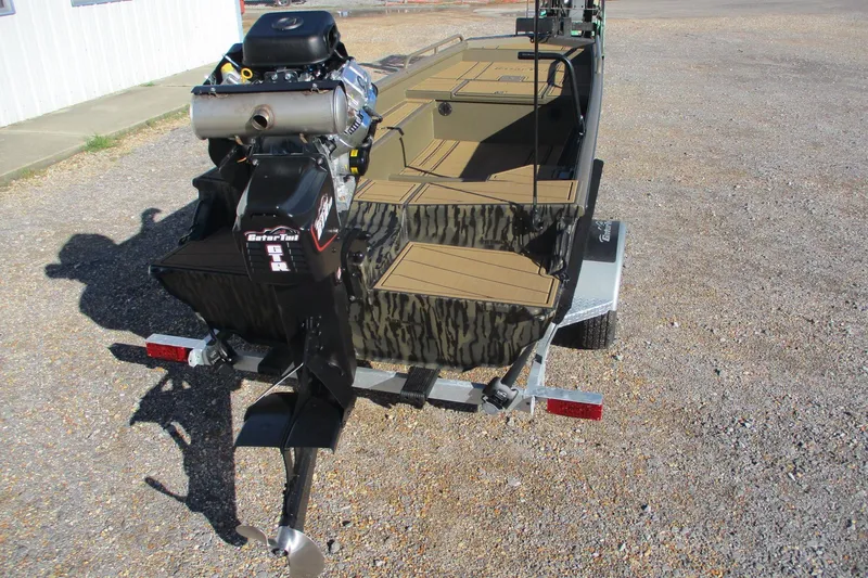 Slide: The Image of 2026 Gator Tail 1750 Savage Mid Deck boat on trailer, rear view, outdoors. - 5