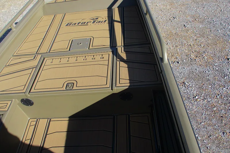 Slide: The Image of 2026 Gator Tail 1750 Savage Mid Deck boat interior with textured flooring. - 9