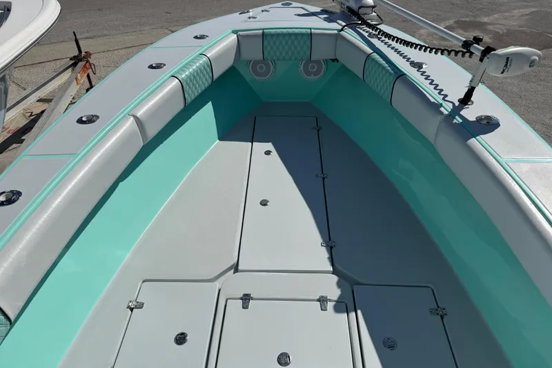 Slide: The Image of 2018 Latitude Tournament Boats Competitor 25 interior with teal and gray seating. - 14