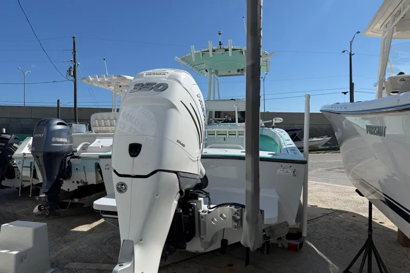 Slide: The Image of 2018 Latitude Tournament Boats Competitor 25 with powerful outboard motor in a marina setting. - 4