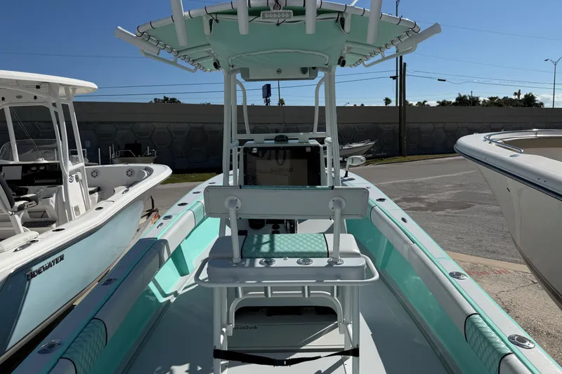 Slide: The Image of 2018 Latitude Tournament Boats Competitor 25, mint green interior, docked in a marina. - 7