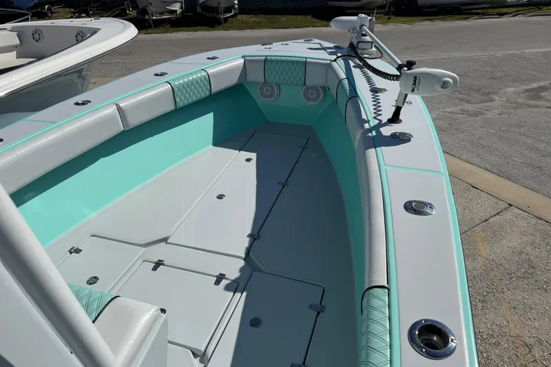 Slide: The Image of 2018 Latitude Tournament Boats Competitor 25, mint green interior, equipped with trolling motor. - 9