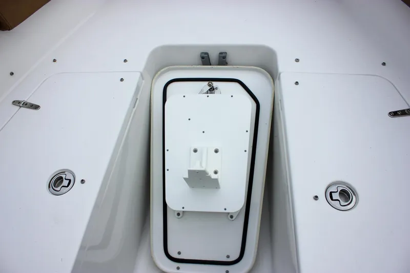 Slide: The Image of 2020 Sea Hunt Ultra 275 SE boat deck with storage compartments and hatch. - 16