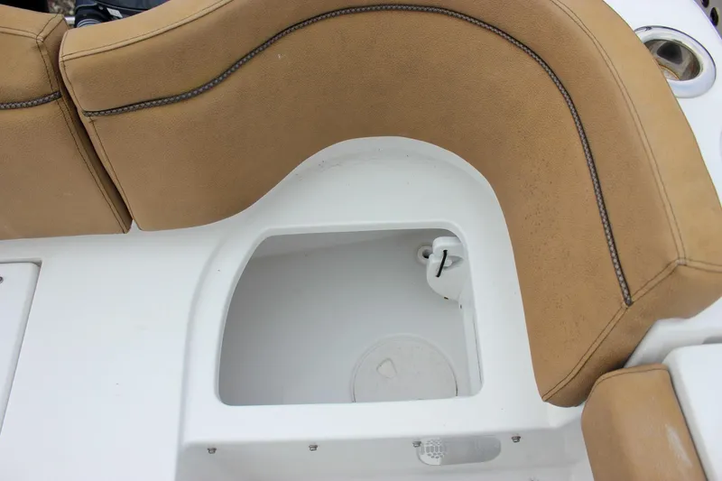 Slide: The Image of 2020 Sea Hunt Ultra 275 SE boat seating with storage compartment. - 24