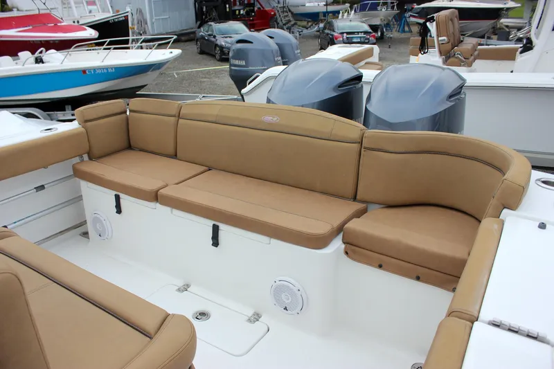 Slide: The Image of 2020 Sea Hunt Ultra 275 SE boat with tan seating and dual engines. - 25