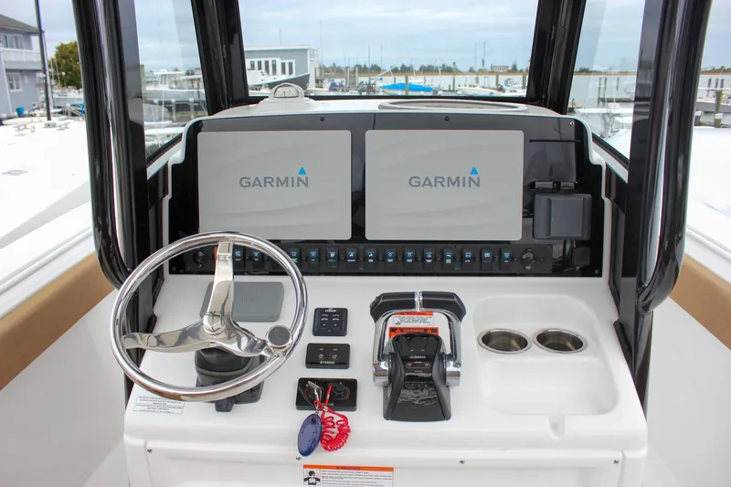 Slide: The Image of 2020 Sea Hunt Ultra 275 SE boat dashboard with Garmin navigation system. - 28