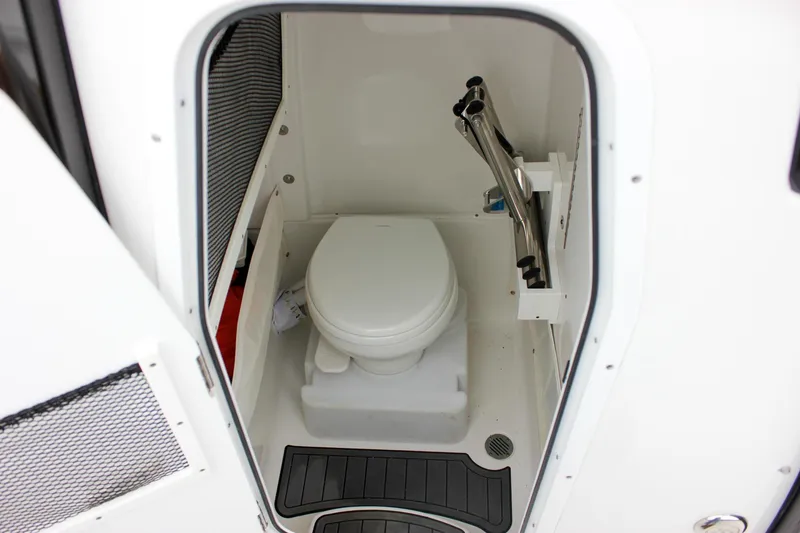 Slide: The Image of 2020 Sea Hunt Ultra 275 SE boat toilet compartment with compact design and modern fixtures. - 34