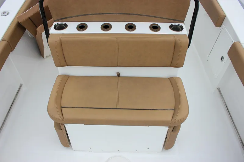 Slide: The Image of 2020 Sea Hunt Ultra 275 SE boat seating with cup holders, tan upholstery. - 4