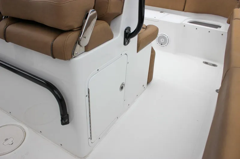 Slide: The Image of 2020 Sea Hunt Ultra 275 SE boat interior with brown seating and white deck. - 41