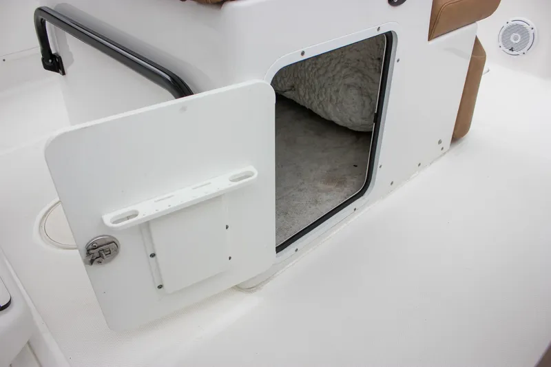Slide: The Image of 2020 Sea Hunt Ultra 275 SE storage compartment with open hatch and interior view. - 42