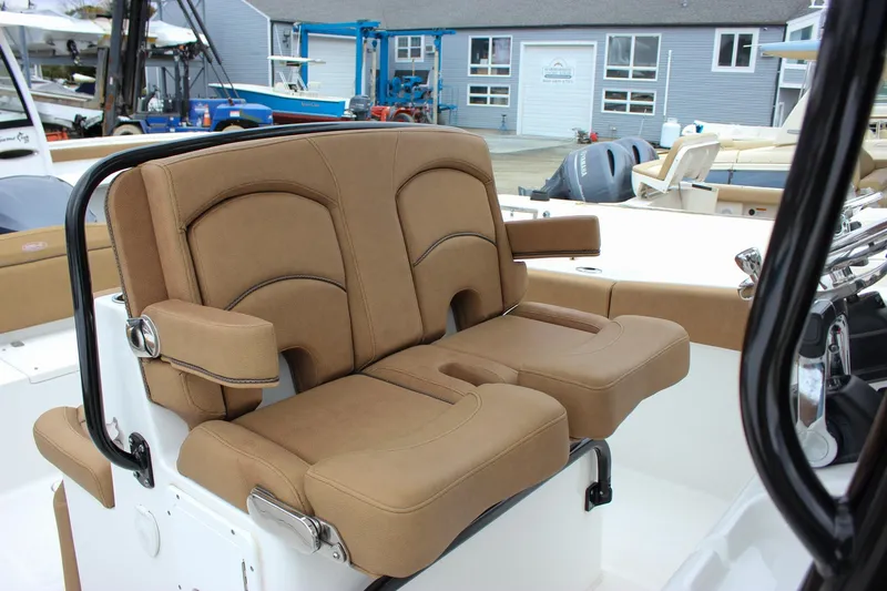 Slide: The Image of 2020 Sea Hunt Ultra 275 SE boat with tan cushioned seating. - 51