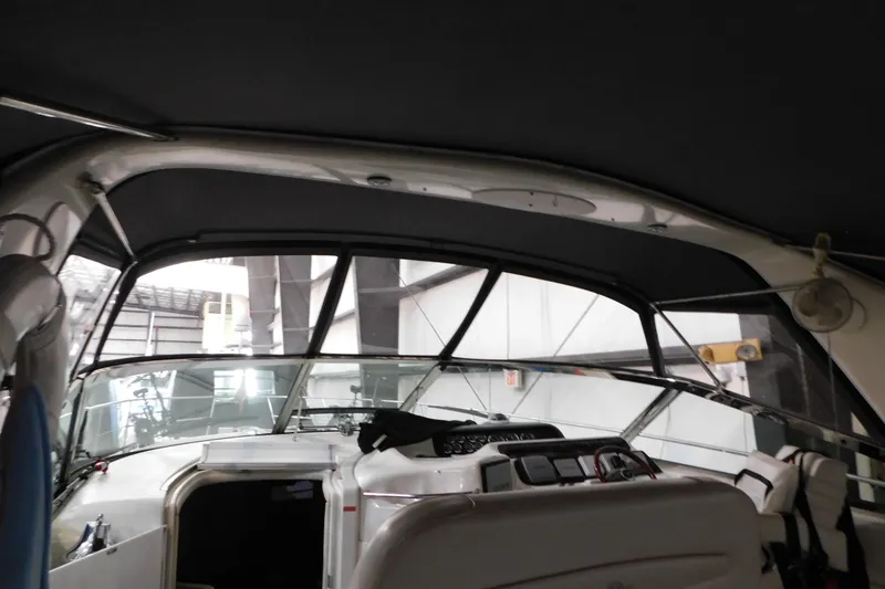 Slide: The Image of Interior view of 1997 Sea Ray 400 Sundancer yacht cockpit with dashboard and seating. - 17