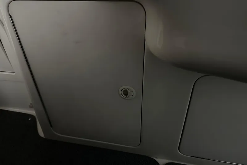 Slide: The Image of 1997 Sea Ray 400 Sundancer interior compartment door with handle. - 29