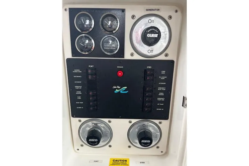 Slide: The Image of Control panel of a 1997 Sea Ray 400 Sundancer boat with gauges and switches. - 31