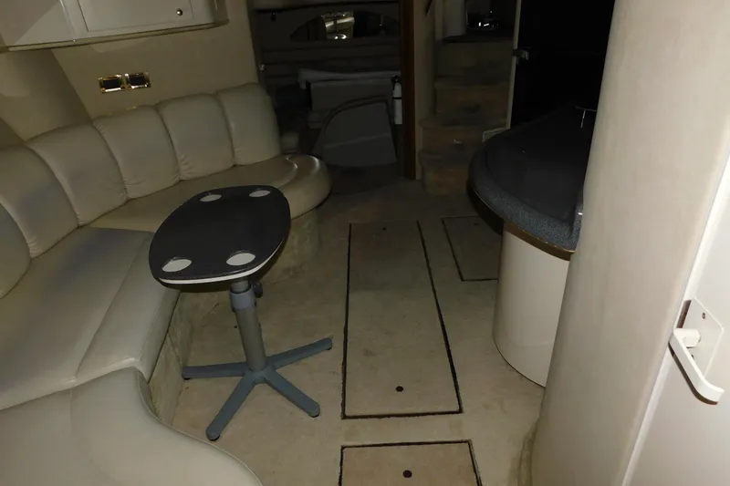 Slide: The Image of Interior of 1997 Sea Ray 400 Sundancer yacht with seating and table. - 37