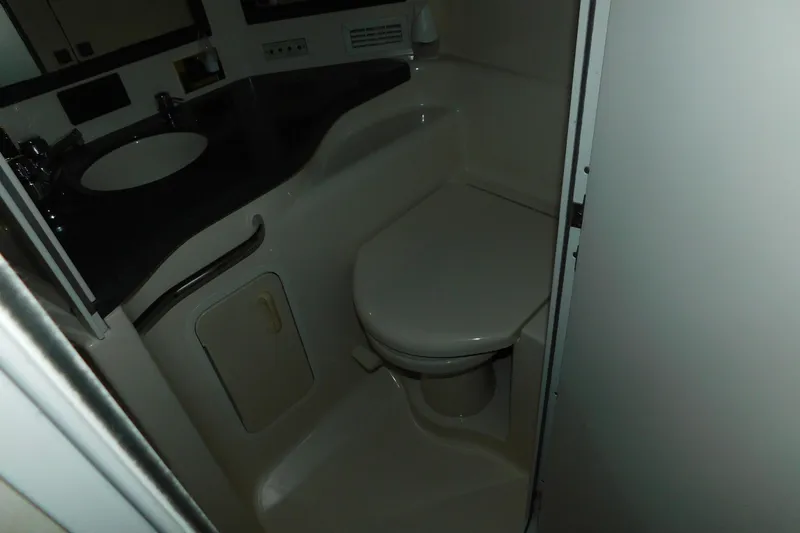 Slide: The Image of Bathroom interior of 1997 Sea Ray 400 Sundancer yacht, featuring sink and toilet. - 45