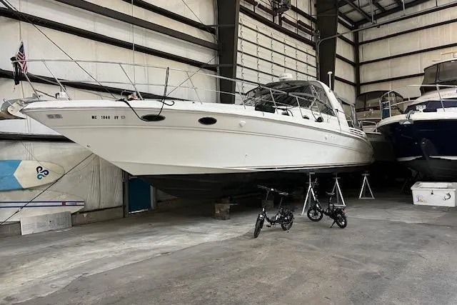 Slide: The Image of 1997 Sea Ray 400 Sundancer yacht in indoor storage facility. - 7