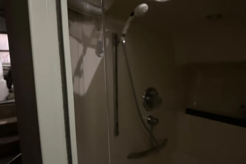 Slide: The Image of Shower area inside 1997 Sea Ray 400 Sundancer yacht, featuring modern fixtures. - 76