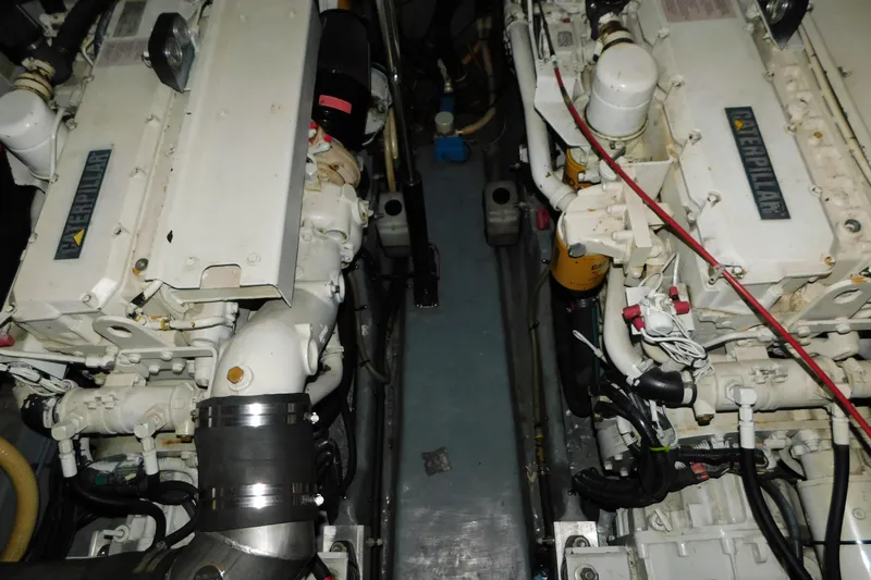 Slide: The Image of Engine room of 1997 Sea Ray 400 Sundancer with twin Caterpillar engines. - 83