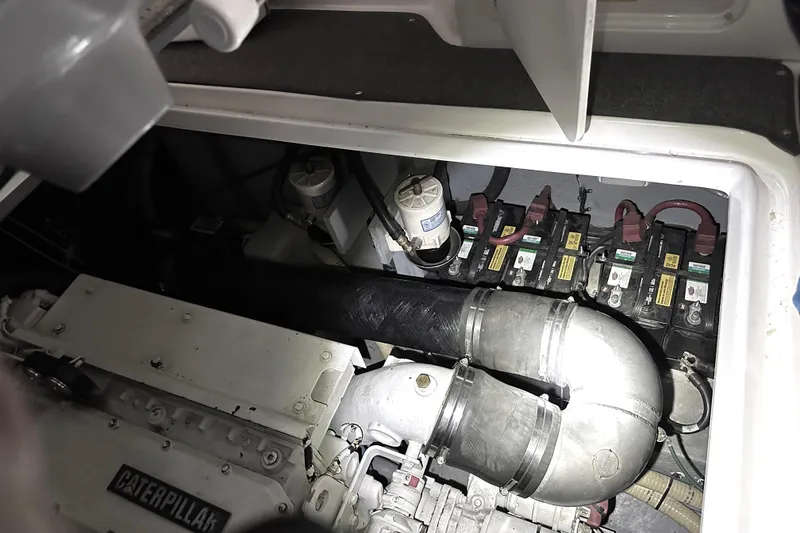 Slide: The Image of Engine compartment of a 1997 Sea Ray 400 Sundancer with Caterpillar engine and batteries. - 85