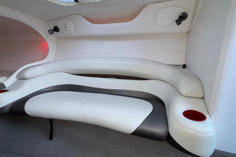 Slide: The Image of Interior seating of 2001 Baja 33 Outlaw boat with white and black upholstery. - 34