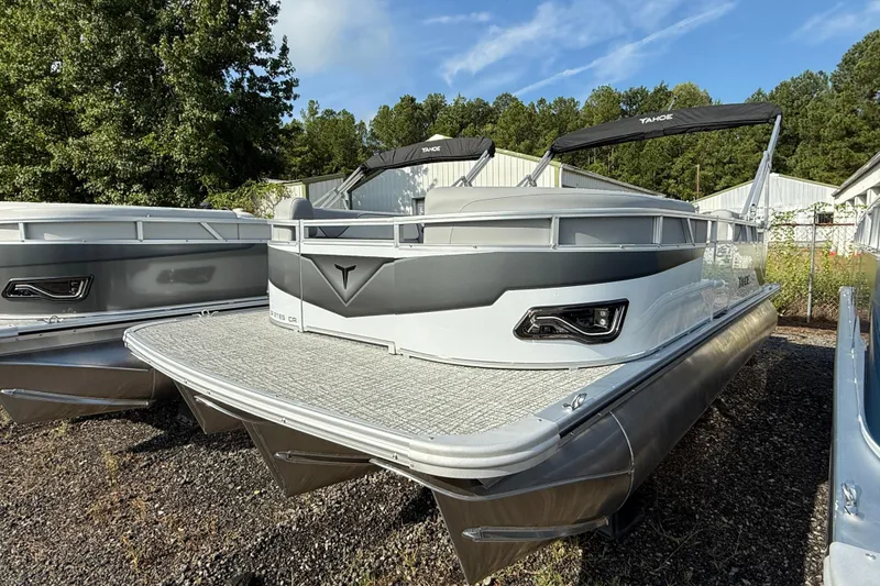 The Image of 2026 Tahoe Pontoon Sport 85 Cruise boat displayed outdoors. - 1