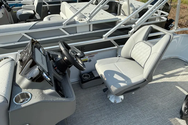 Slide: The Image of 2026 Tahoe Pontoon Sport 85 Cruise interior with steering console and captain's chair. - 4