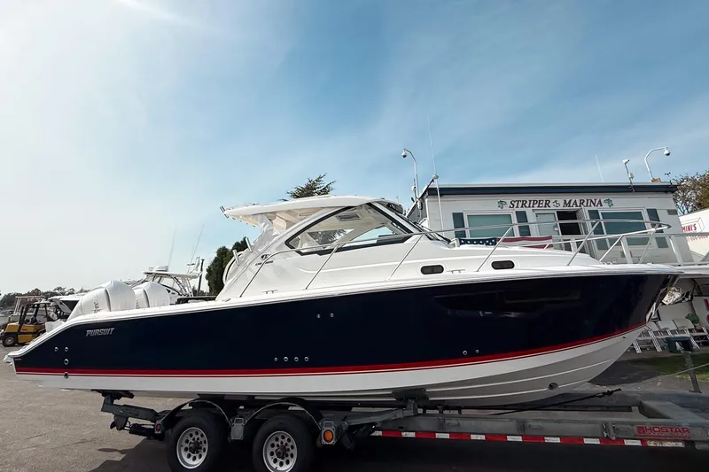 The Image of 2026 Pursuit OS 325 Offshore boat on trailer at Striper Marina. - 0