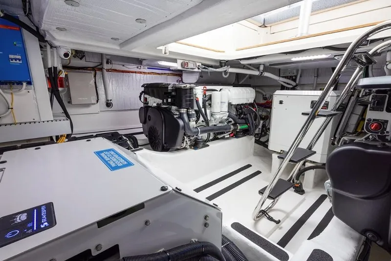 Slide: The Image of Engine room of 2026 Sabre 45 Salon Express yacht, featuring modern equipment and sleek design. - 7
