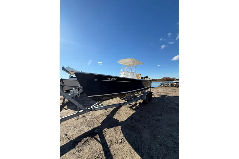 Slide: The Image of 2020 Bristol Harbor Vanquish boat on trailer under clear blue sky. - 3