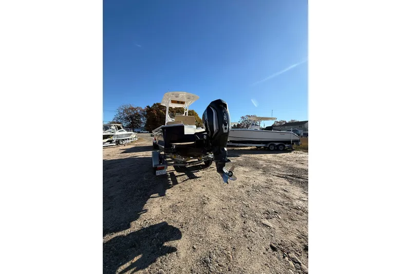 Slide: The Image of 2020 Bristol Harbor Vanquish boat on trailer under clear blue sky. - 5