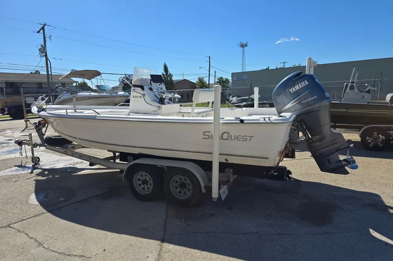 Slide: The Image of 2006 Sea Quest 2100 Probay boat with Yamaha outboard motor on a trailer. - 10