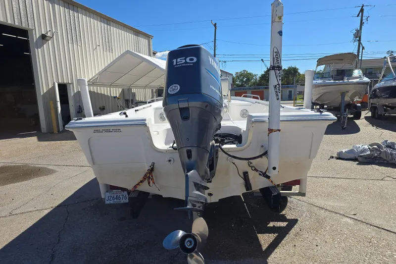 Slide: The Image of 2006 Sea Quest 2100 Probay boat with Yamaha 150 outboard motor in a marina. - 3