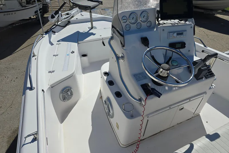 Slide: The Image of 2006 Sea Quest 2100 Probay boat interior with steering console and navigation equipment. - 8